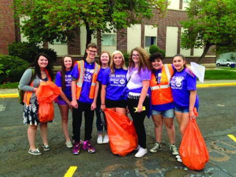 A group of seniors pick up trash as a part of Day of Caring. Photo courtesy of Christina Cahill. 