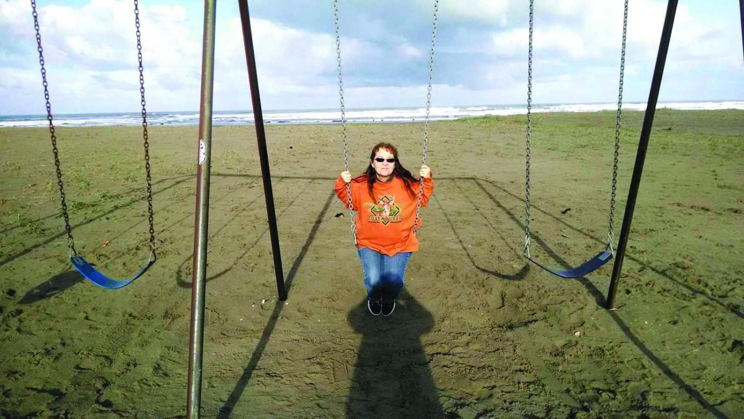 Arnett swings on the beach, ready to spend much of her retirement here.