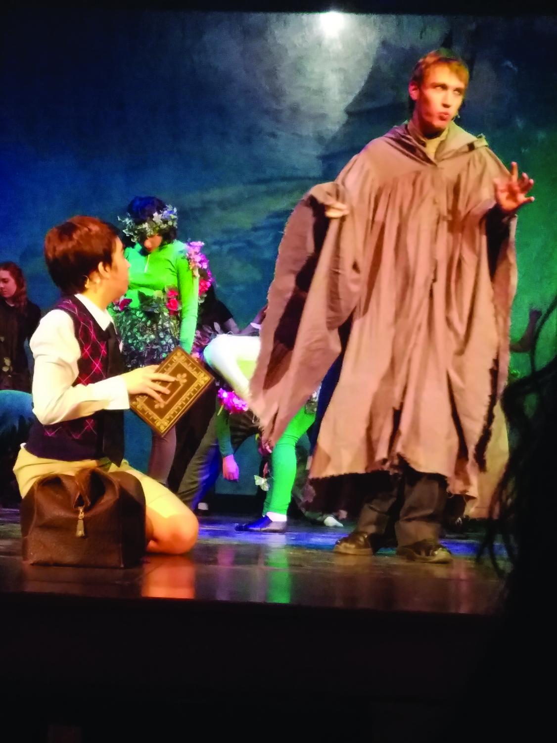 Senior Zach Haas (Ladahlord) tries to convince sophomore Caroline Gibbs (James) to indulge in “wild magic.”
