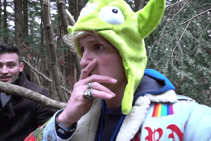Logan Paul deep in thought as he records body of suicide victim. photo courtesy of nymag.com