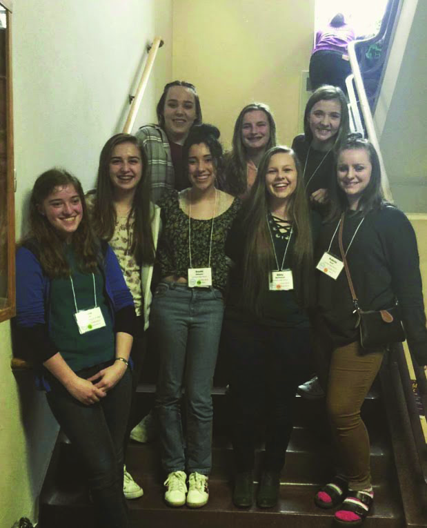 (Left to right) Rose Hale, Caroline Gibbs, Kenzie Lorton, Ani Galeano, Kari Wilsey, Abby Myklebust, Julia Williams and Aubrie Hunt, stand together to celebrate their time at All-State Choir.