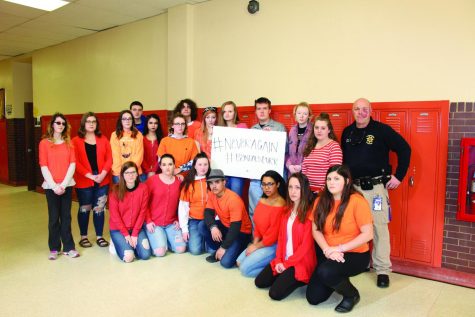 The current staff of The Bengals Purr at Lewiston High School, with LHS student resource officer, Robert Massey. 
