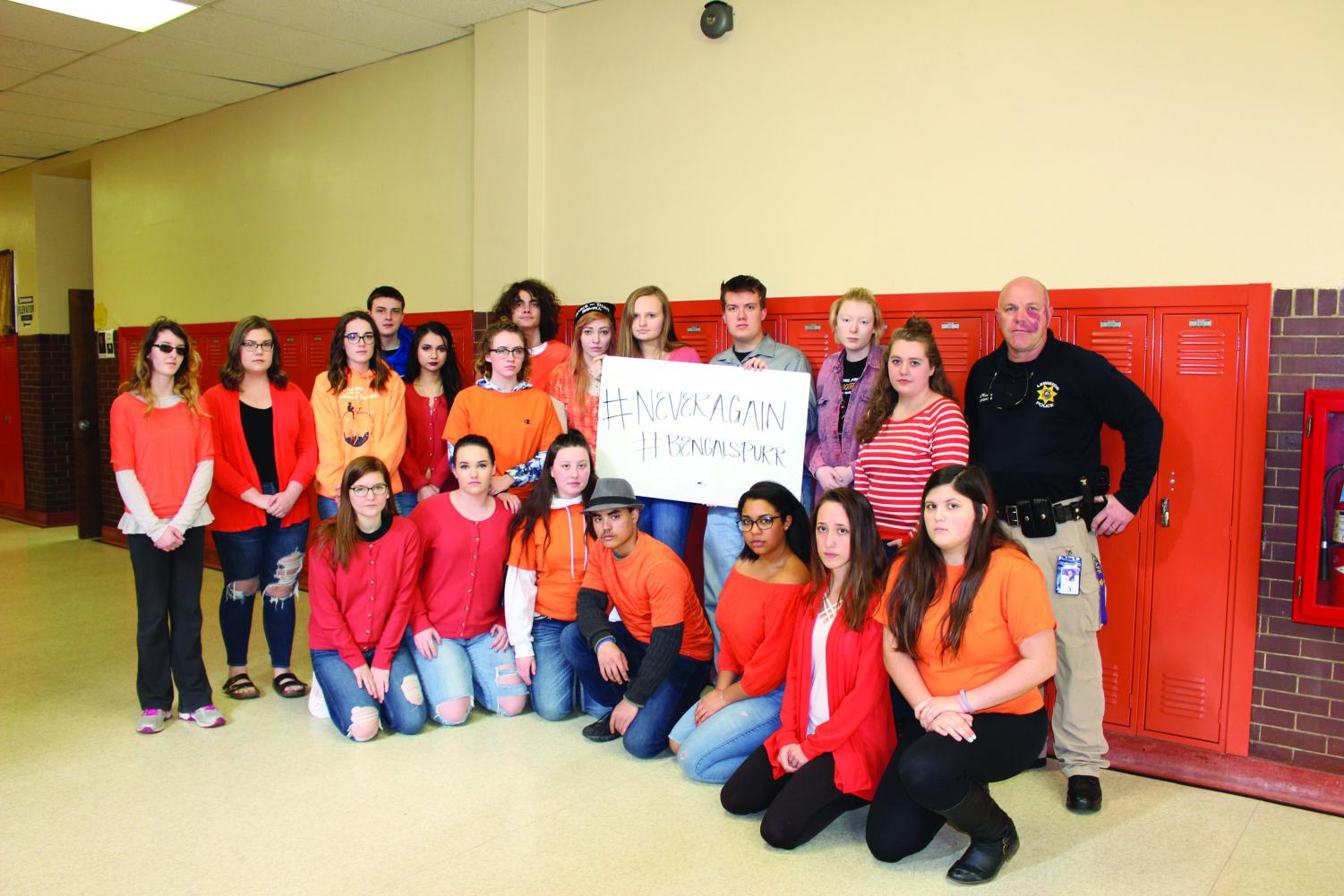 The current staff of The Bengal's Purr at Lewiston High School, with LHS student resource officer, Robert Massey.