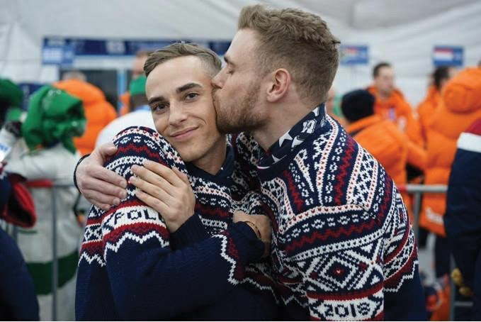 U.S. Olympian Adam Rippon smiles while fellow athlete Gus Kenworthy kisses him on the cheek the morning of Feb. 9 in Pyeong-Chang, South Korea. 