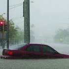 A car is submerging on the streets of Hawaii after floods  from hurricane Lane. Photo courtesy of nymag.com