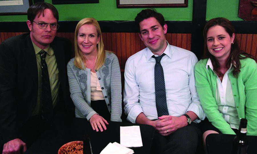 Dwight, Angela, Jim, and Pam sit together. Photo courtesy of IMDb.