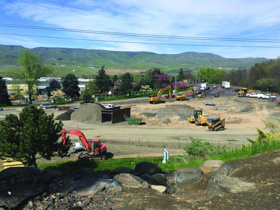 Construction workers realign the intersection between 21st Street and US 12 on a sunny afternoon April 22. 