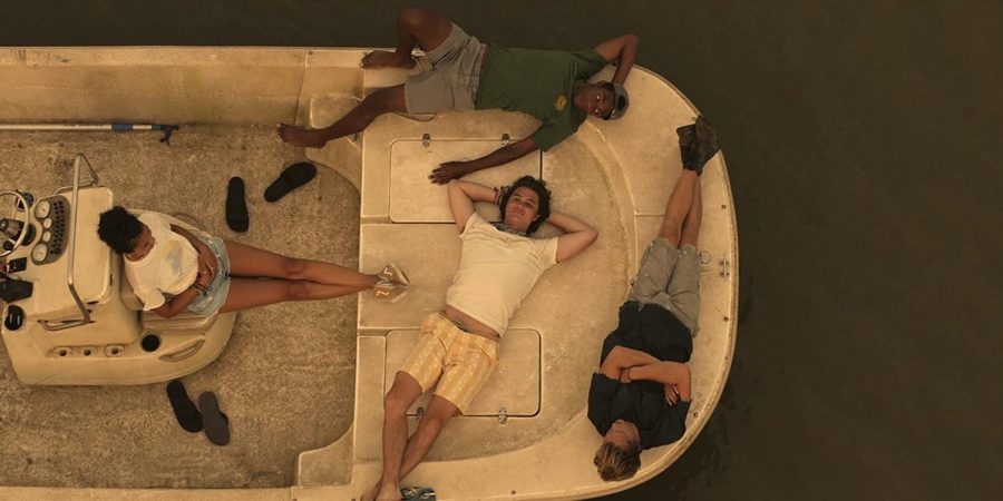 Actors from new Netflix show, Outer Banks, lay on a boat during filming in the summer. Photo courtesy of IMDb.