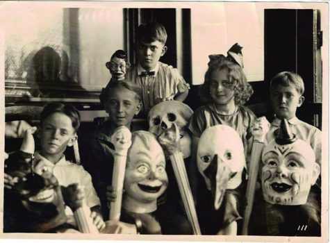 Children pose for their photo with their Halloween costumes.  Photo courtsey of History Daily.