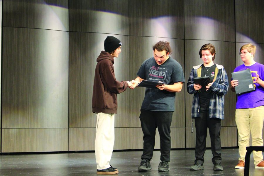 (From left right) Dekin Carney, Ayden Diaz, Cale Wilponen and Zachary Steadman read their scripts as they practice their lines for the play.