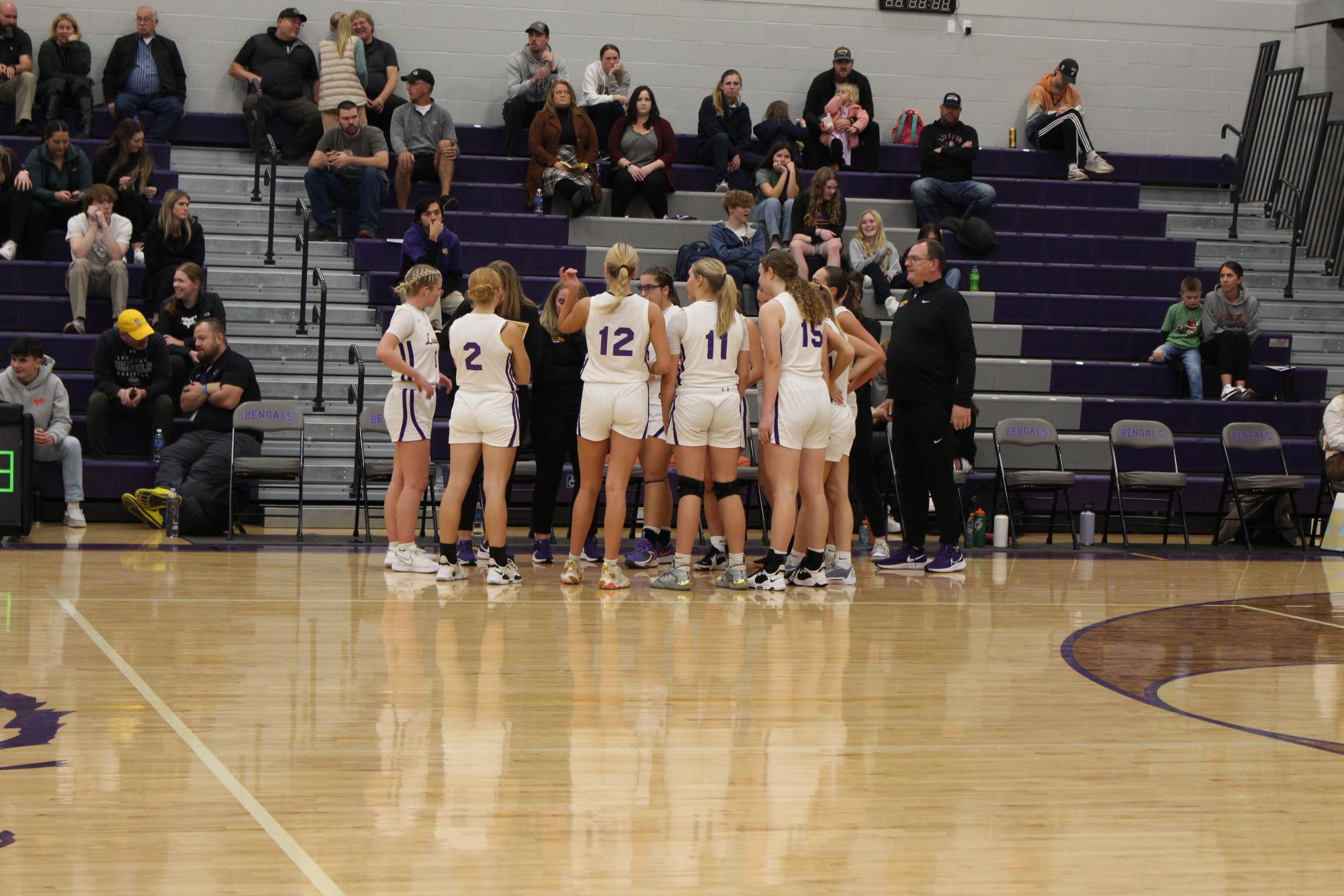 Lady Bengals huddle in December 2023