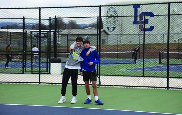 Drew Hartwig and Lorenzo Aprati pause on the courts. Photo courtesy of LHS Tennis on Instagram.