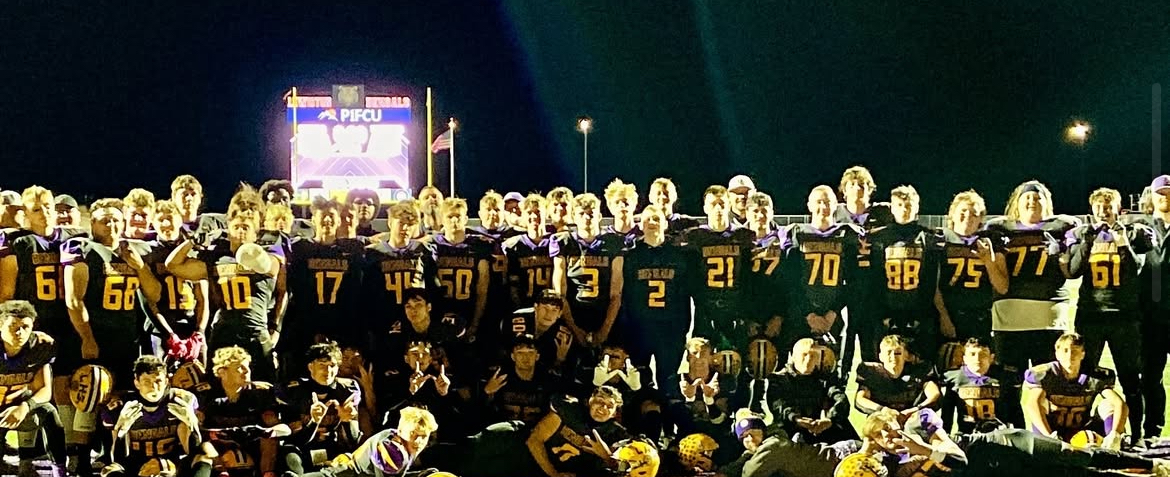 Varsity football players celebrate their first ever victory at the inaugural game of the P1FCU Sports Complex.