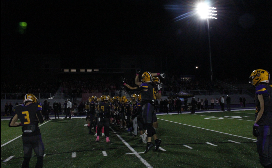 Two Bengals Football Players greet each other during starting lineup