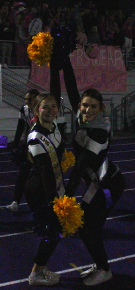 Seniors Savannah Swallow and Natalie Gilmore celebrate last game as Bengals Cheerleaders