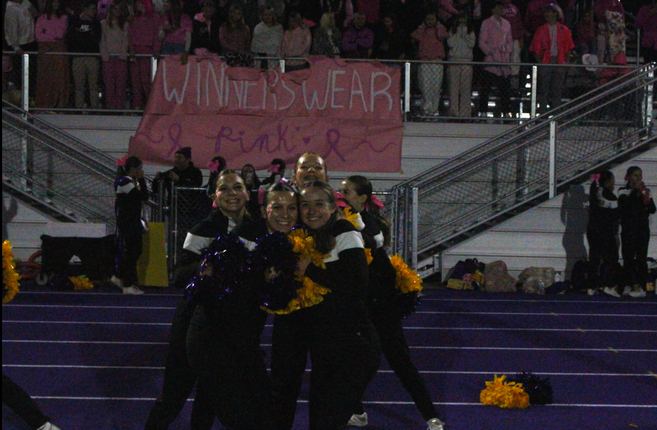 Bengals Cheerleaders pose in front of Lewiston student's section (Left to Right): Natalie Witt, Savannah Gonzales, Kyla Nesset, Gracie Hepburn, and Kaylee Stachofsky