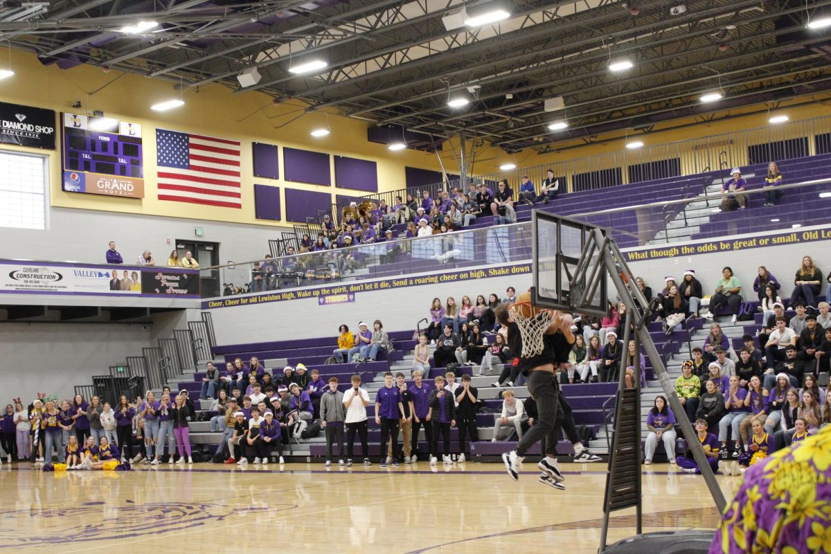 Quick Basketball 1v1's with student vs. Teachers to lighten the mood at GOLDEN THRONE Assembly 2024 12/13/2024