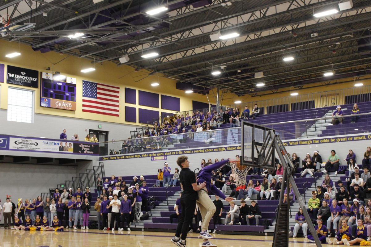 Quick Basketball 1v1's with student vs. Teachers to lighten the mood at GOLDEN THRONE Assembly 2024 12/13/2024