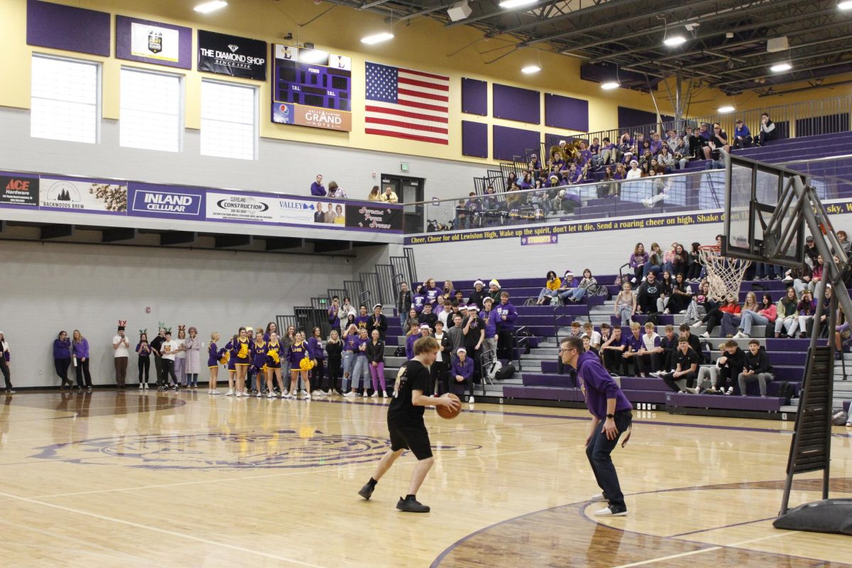 Quick Basketball 1v1's with student vs. Teachers to lighten the mood at GOLDEN THRONE Assembly 2024 12/13/2024