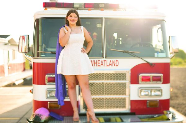 Mercedes Moore poses in front of a Wheatland firetruck. Photo courtesy of Moore.