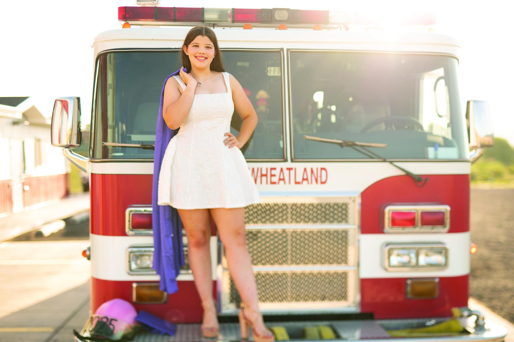Mercedes Moore poses in front of a Wheatland firetruck. Photo courtesy of Moore.