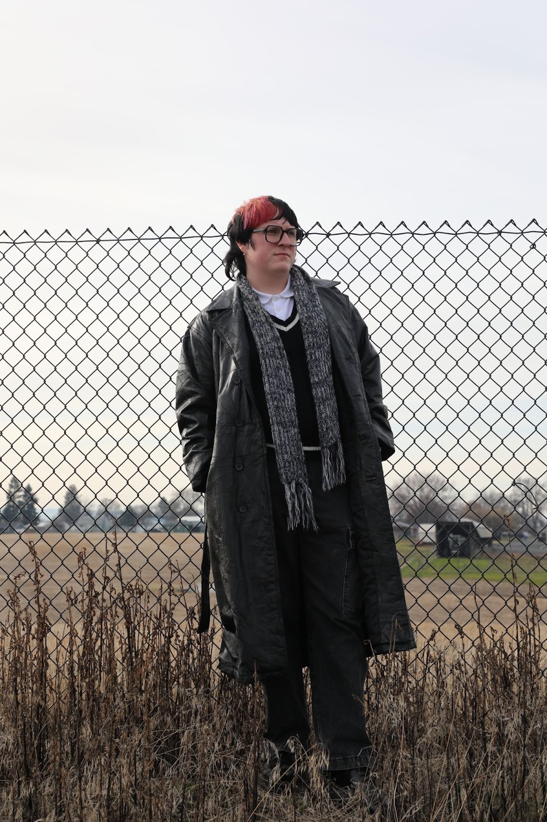 Dugger stranding in a field around noon wearing his trench coat he wore for his Mina's Song music video